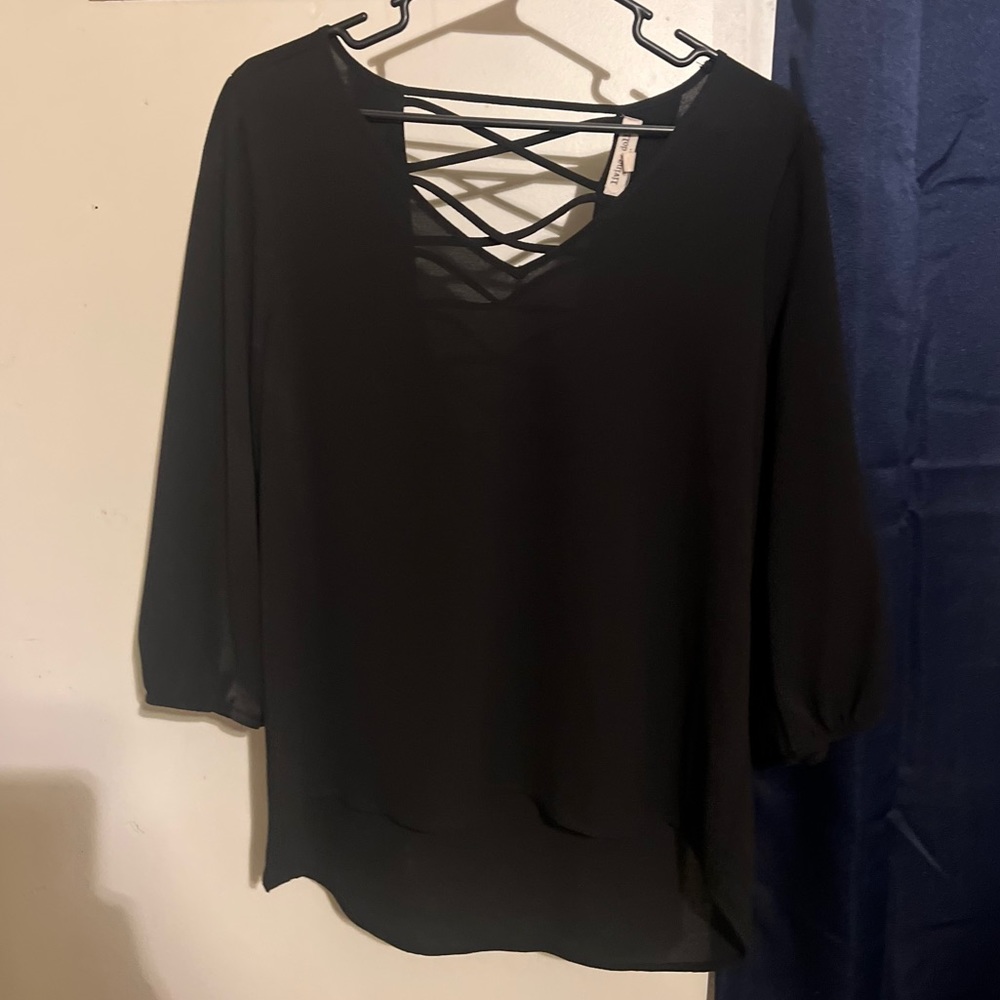 Sheer blouse with criss-cross back